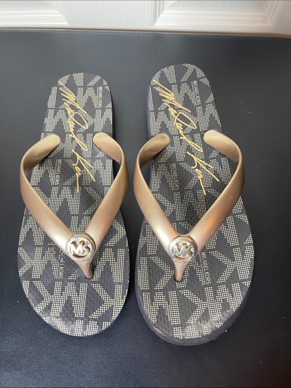 Michael Kors Black and Gold Logo Flip Flop Sandals